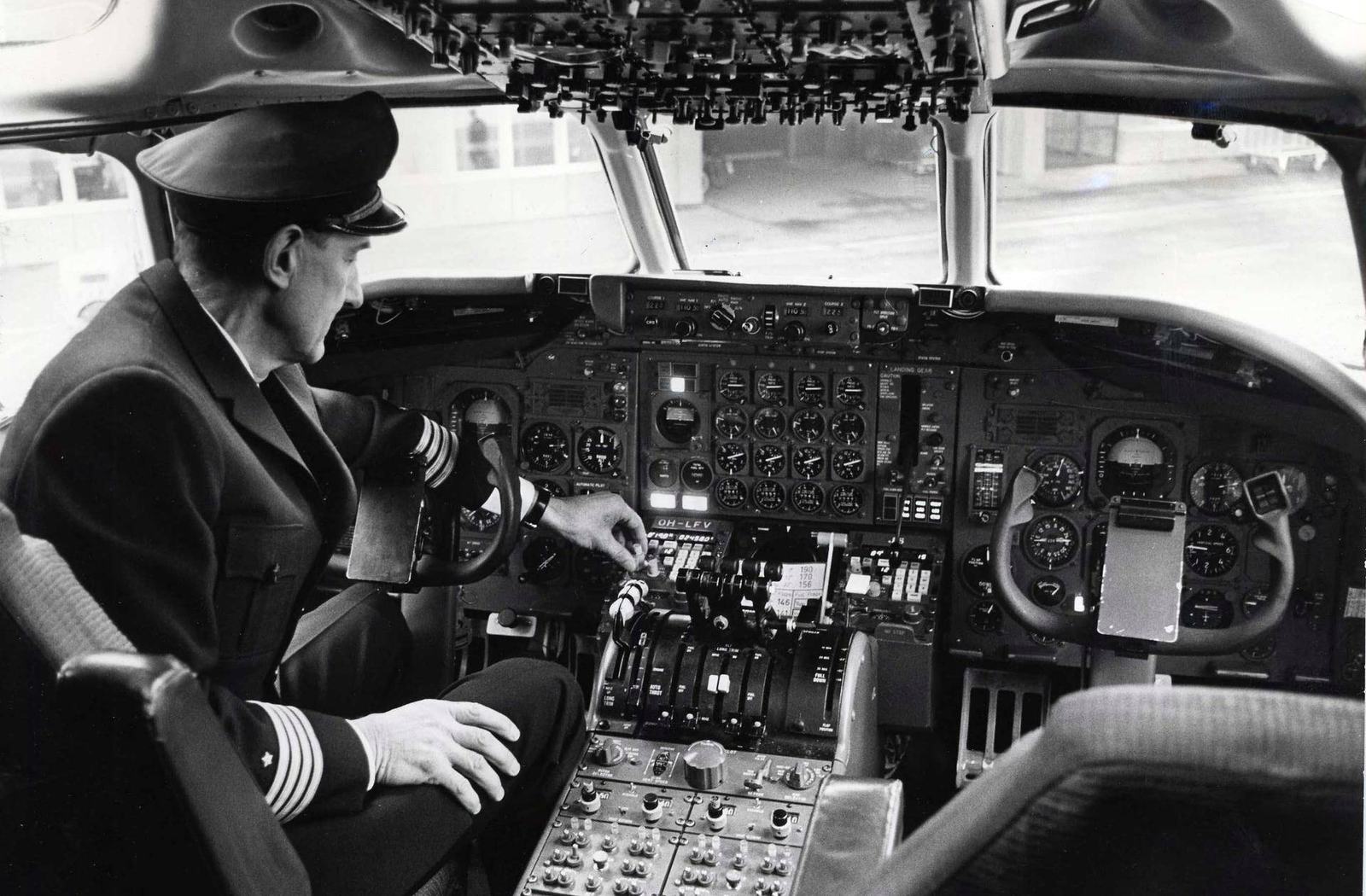 Airline captain at the flight deck controls, 1969