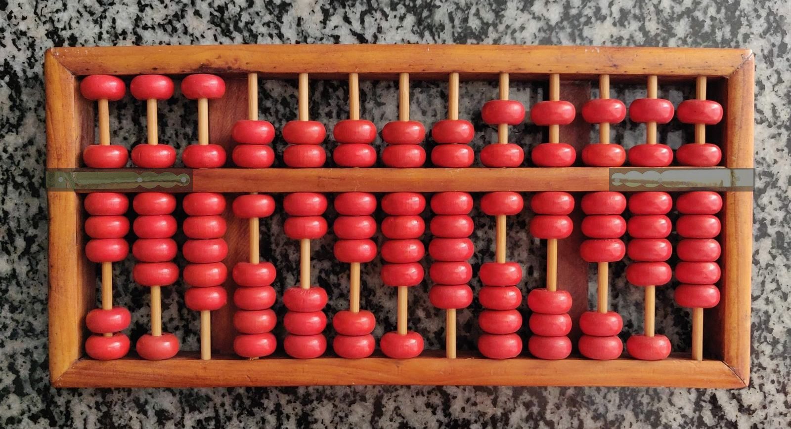 Traditional wooden Chinese abacus on stone