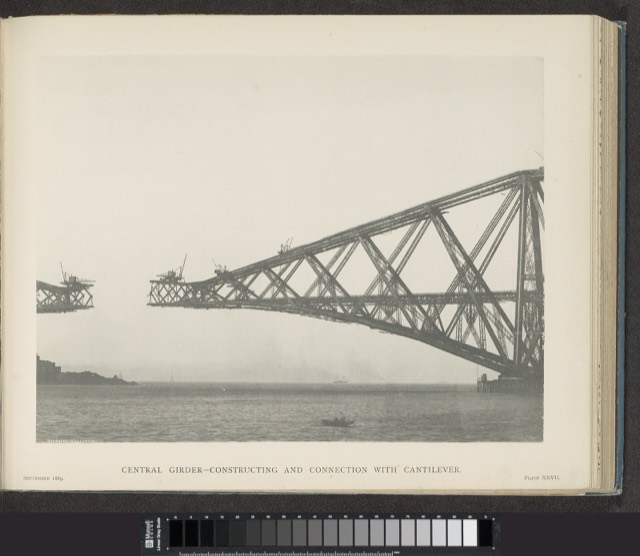 The Forth Bridge under construction, its steel cantilever reaching out over the water towards the next section