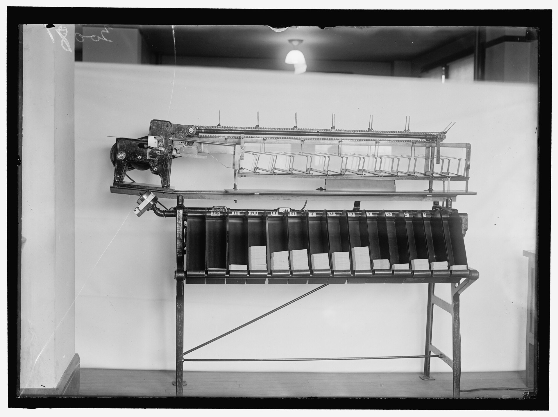 A punched-card sorting machine at the US Census Bureau, its row of pockets holding sorted stacks of cards